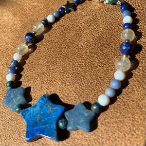 Blue, white and brown beaded bracelet with Star charms.